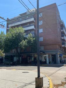 a pole on a street in front of a building at Dpto 9 DE JULIO in Villa María