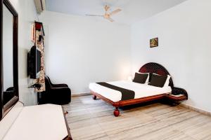 Postel nebo postele na pokoji v ubytování Hotel O Padampura Near Railway Station