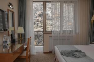 Postel nebo postele na pokoji v ubytování Jannat Resort