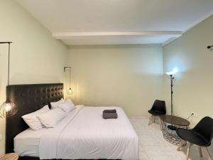 Postel nebo postele na pokoji v ubytování Pause Inn guesthouse