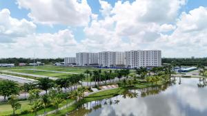 an aerial view of a large apartment complex next to a river at Chung cư Nam Long 2 Central Lake - Block E in Cái Răng