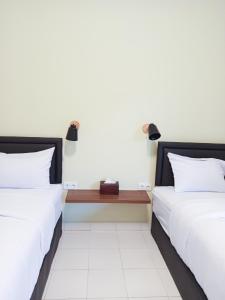 Postel nebo postele na pokoji v ubytování Pause Inn guesthouse