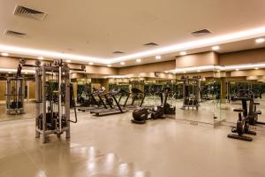 a gym with a lot of treadmills and machines at Park Dedeman Bostanci Hotel in Istanbul