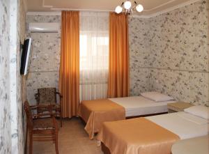 Кровать или кровати в номере Отель Премьер