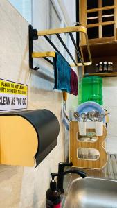 a kitchen sink with a dish drying rack next to it at Tierra Bella-Exclusive Beachfront Villa at Elyu in Bauang +65 photos