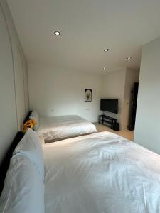 Ein Bett oder Betten in einem Zimmer der Unterkunft 無門禁24小時進出-遇見礁溪lll免費停車
