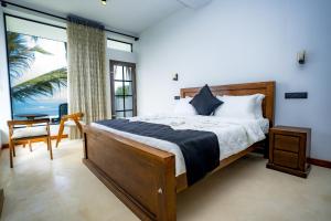 Postel nebo postele na pokoji v ubytování Secret Bay Resort Weligama