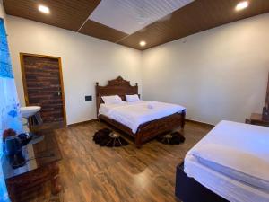 Voodi või voodid majutusasutuse Hampi Shukra Guest House toas