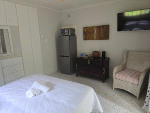 Ένα ή περισσότερα κρεβάτια σε δωμάτιο στο River Heaven BnB