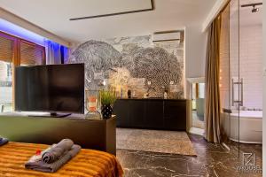 Μια τηλεόραση ή/και κέντρο ψυχαγωγίας στο Jacuzzi Rakowicka Top Apartments