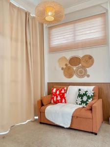 a living room with a couch and a window at Casa nel Mezzo - A Pineapple Farm Escapee in Ulot +41 photos