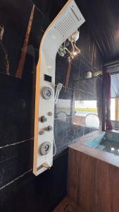 a bathroom with a sink and a bath tub at Vistara Beach Resort Malpe - Udupi in Udiyāvara