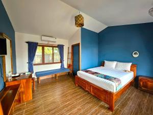 Postel nebo postele na pokoji v ubytování Ong Lang Bay Resort