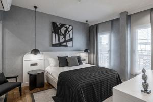 a bedroom with a bed and a chair at Ena Boutique Hotel & Residences in Bodrum City +104 photos
