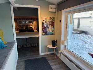 a room with a bedroom with a bed and a window at Magical premium home in the best location in Bovallstrand +85 photos