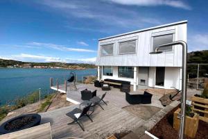 a house with a view of the water at Magical premium home in the best location in Bovallstrand