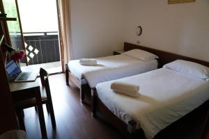 Postel nebo postele na pokoji v ubytování Hotel Davost
