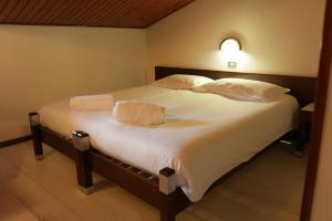 Postel nebo postele na pokoji v ubytování Hotel Davost