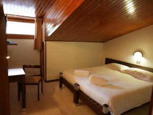 Postel nebo postele na pokoji v ubytování Hotel Davost