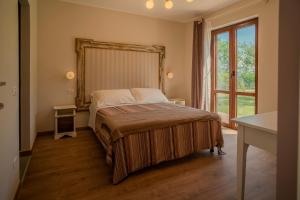 Postel nebo postele na pokoji v ubytování Agriturismo Violati