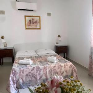 Postel nebo postele na pokoji v ubytování Gianmaria B&B