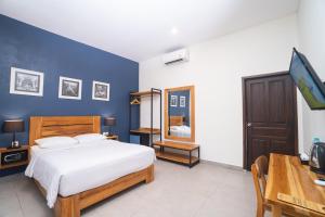 Кровать или кровати в номере La Casa Jogja