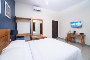 Кровать или кровати в номере La Casa Jogja