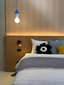 Llit o llits en una habitació de LAZYDAY IN NIMMAN