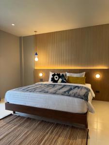 Llit o llits en una habitació de LAZYDAY IN NIMMAN