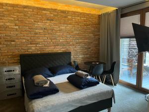 Ένα ή περισσότερα κρεβάτια σε δωμάτιο στο Jacuzzi Rakowicka Top Apartments