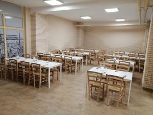 a dining room with tables and chairs in it at Hotel Prim in Bratislava