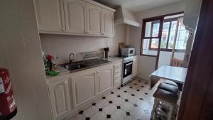 Kuchyňa alebo kuchynka v ubytovaní Maritima Beach apartamento