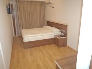 Postel nebo postele na pokoji v ubytování Merkez Otel