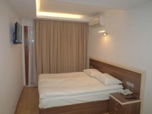 Postel nebo postele na pokoji v ubytování Merkez Otel