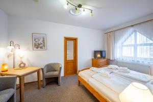 Ένα ή περισσότερα κρεβάτια σε δωμάτιο στο Hotel Sanatorium Mariot