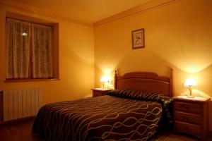 Posteľ alebo postele v izbe v ubytovaní Apartaments La Llucana