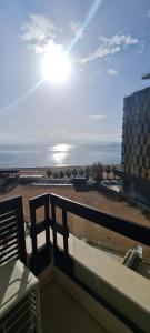 a view of the beach from the balcony of a building at CASA AL MARE RESIDENCE in Bečići