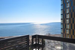 a view of the ocean from the balcony of a building at CASA AL MARE RESIDENCE in Bečići