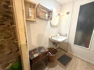 a small bathroom with a sink and a toilet at Suite Vecchio Frantoio - Sanremo in Sanremo