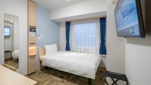 TV a/nebo společenská místnost v ubytování Toyoko Inn Sakai Ekimae