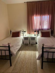 Postel nebo postele na pokoji v ubytování Baytna Hotel