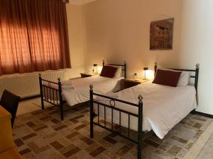 Postel nebo postele na pokoji v ubytování Baytna Hotel