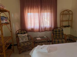 Postel nebo postele na pokoji v ubytování Baytna Hotel