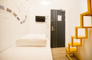 Postel nebo postele na pokoji v ubytování SleepBox Hostel