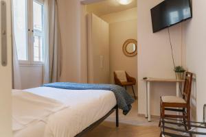 A bed or beds in a room at Affittacamere Zanobi 45