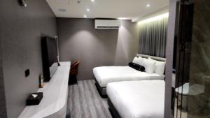 TV a/nebo společenská místnost v ubytování Jiati Business Motel