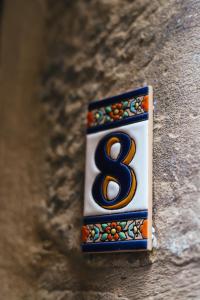 a metal object with the number eight on it at Número 8 a Traditional Basque Village Homestead in Laguardia