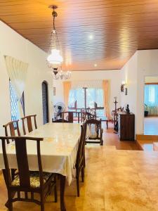 a dining room with a table and chairs and a room at Gee Hills in Weligama +18 photos
