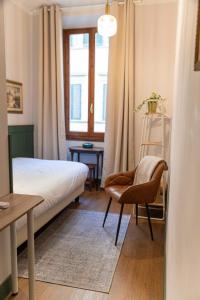 A bed or beds in a room at Affittacamere Zanobi 45