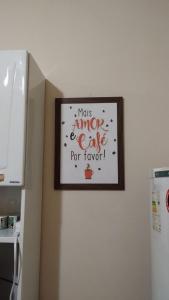 a picture on a wall with a sign on it at Smart Flat Rio in Rio de Janeiro